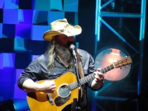 Chris Stapleton performing live with an acoustic guitar at the Xfinity Center in Mansfield, Ma on June 320, 2019