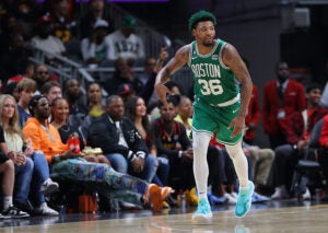 ATLANTA, GEORGIA - APRIL 23: Marcus Smart #36 of the Boston Celtics reacts after a three-point basket against the Atlanta Hawks during the third quarter of Game Four of the Eastern Conference First Round Playoffs at State Farm Arena on April 23, 2023 in Atlanta, Georgia. NOTE TO USER: User expressly acknowledges and agrees that, by downloading and or using this photograph, User is consenting to the terms and conditions of the Getty Images License Agreement.