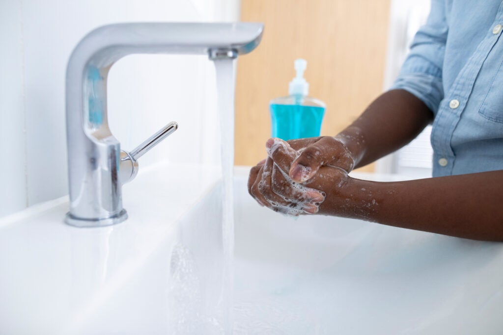 man washing his hands