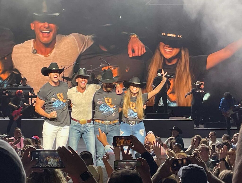 Tim McGraw taking a bow with Russell Dickerson and opening acts