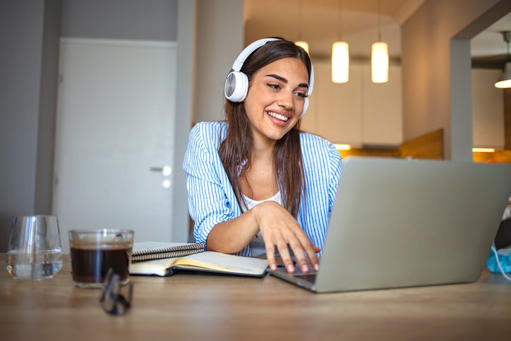 woman laptop headphones