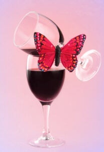 red wine and fake butterflies