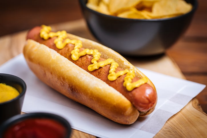 Fresh Hot Dog on Wooden Background