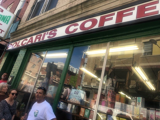 Tour guide Bobby of Boston's North End Food Tour in front of an historic coffee shop