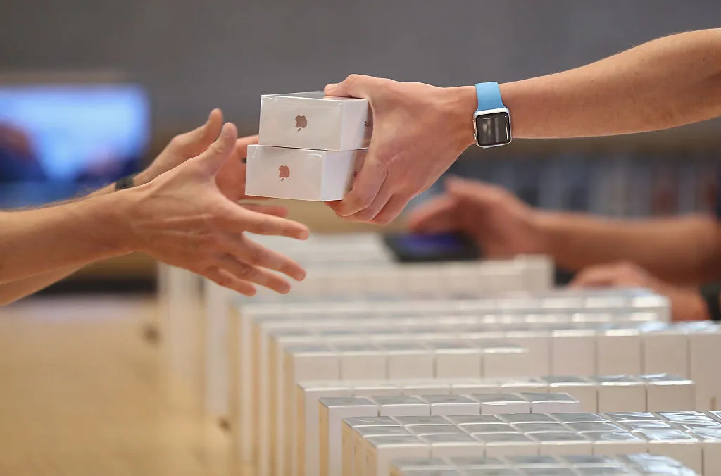 iphone in the boxes being handed to customers