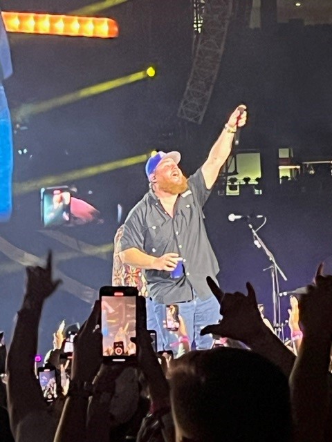 Luke Combs performs at Gillette Stadium -night #2 and holds the microphone up for all to join in