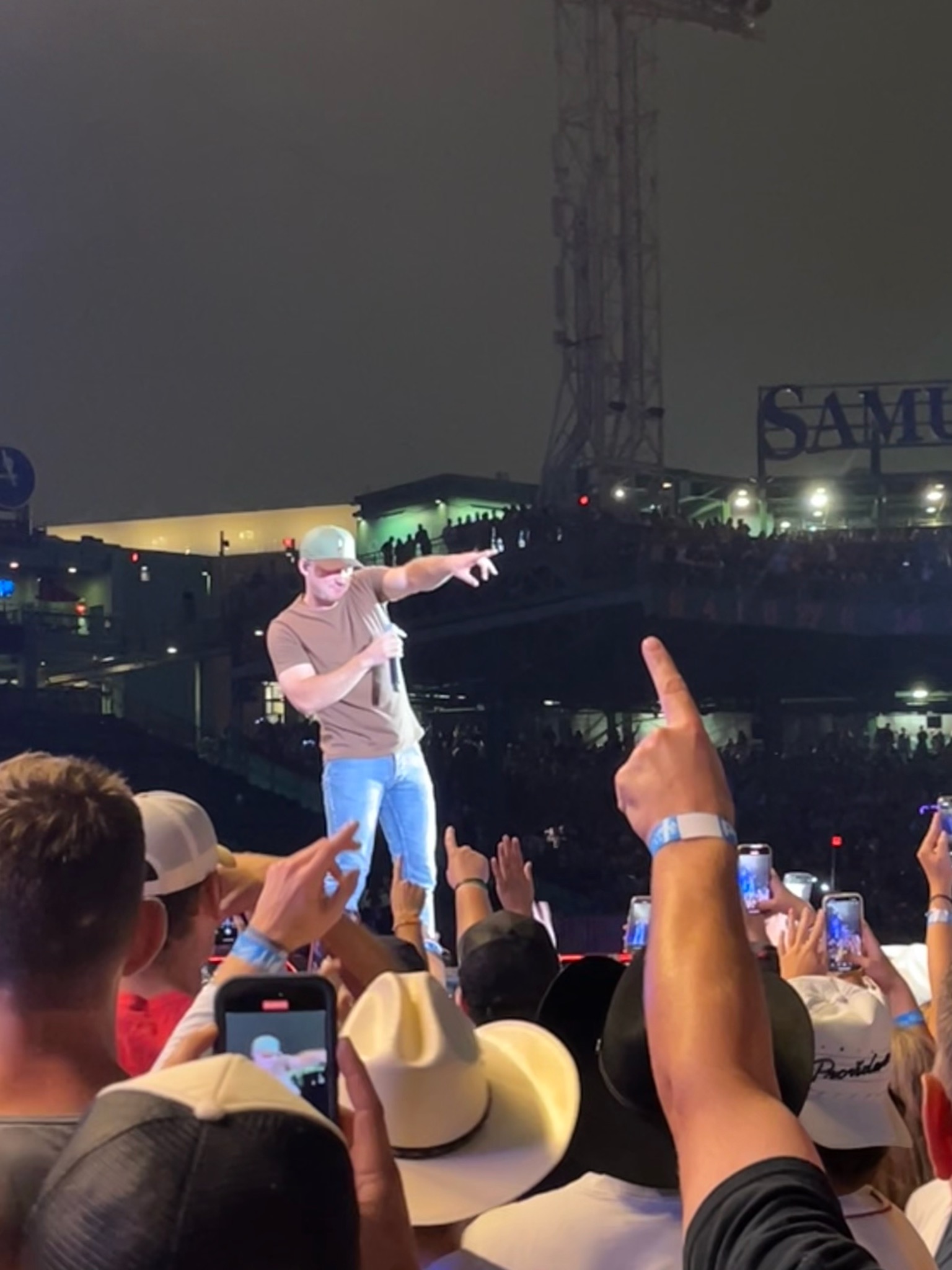 Morgan Wallen on stage at Fenway Park 2023 -pointing to the crowd