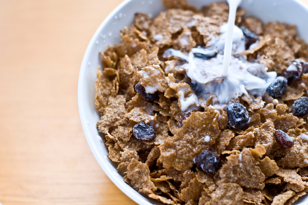 raisin cereal with milk in a bowl