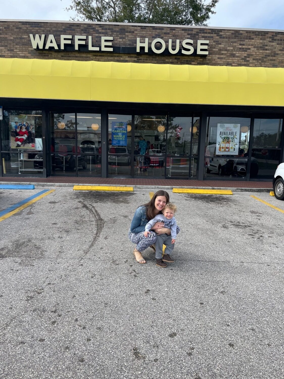 Ayla Brown and Barrett Bellamy in Front of a Waffle House. 