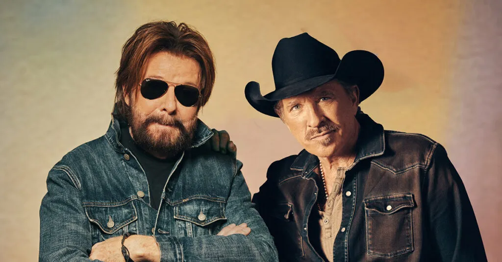 Photo of Brooks & Dunn against a pastel gradient background