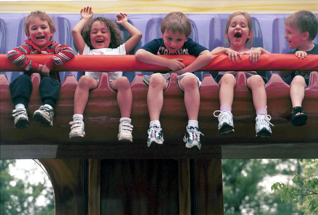 young kids on a park ride at six flags New England
