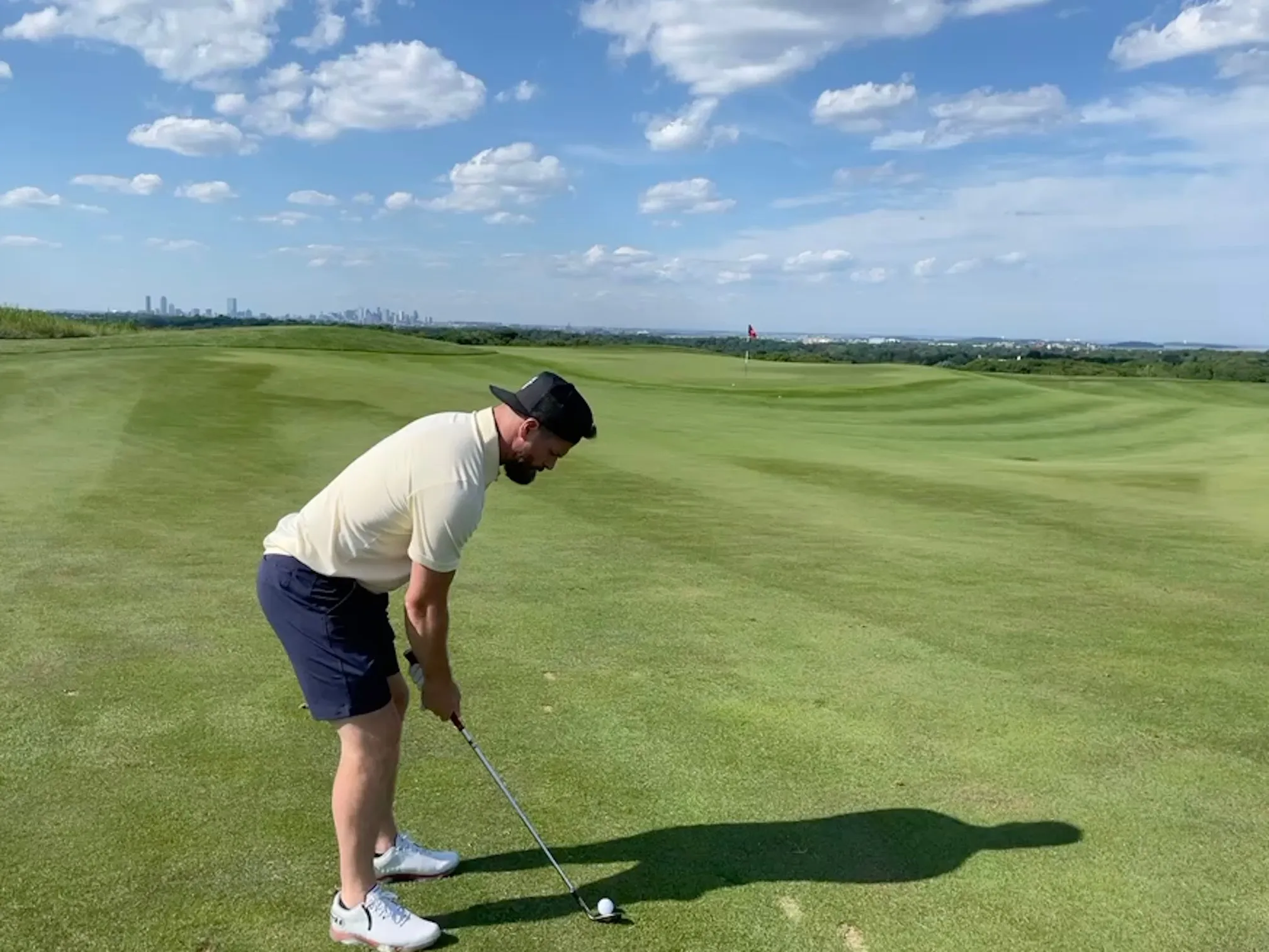 Rob Bellamy swinging a golf club on a golf course