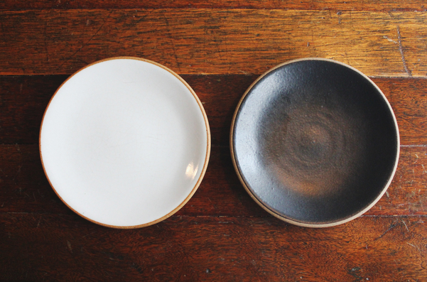 Empty two plates (dish and bowl). Table setting for two on wooden table