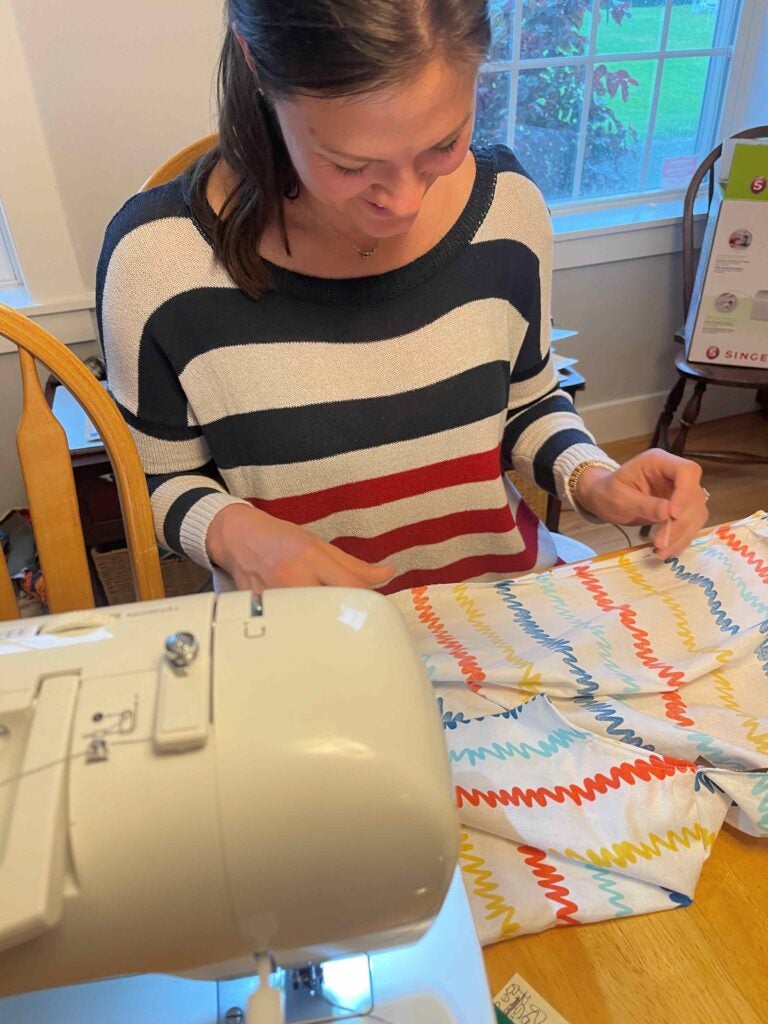 Ayla Brown sewing at her sewing machine