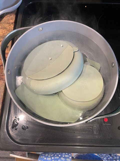 smelly children's bowl in boiling hot water