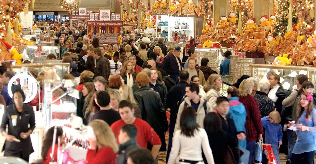 Shoppers clog the aisles at Macy's Department store November 28, 2003 in New York City. Black Friday , the day after Thanksgiving and traditionally the kickoff to the Christmas shopping season is expected to be big, thanks to a rebounding U.S. economy that is positioned to drive better deals, particularly of higher-end goods.