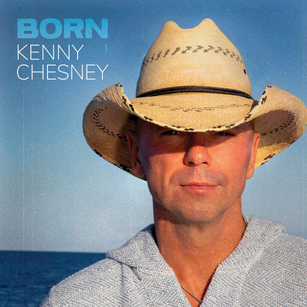 Kenny Chesney in a straw cowboy hat and gray shirt on his album cover for "Born." 