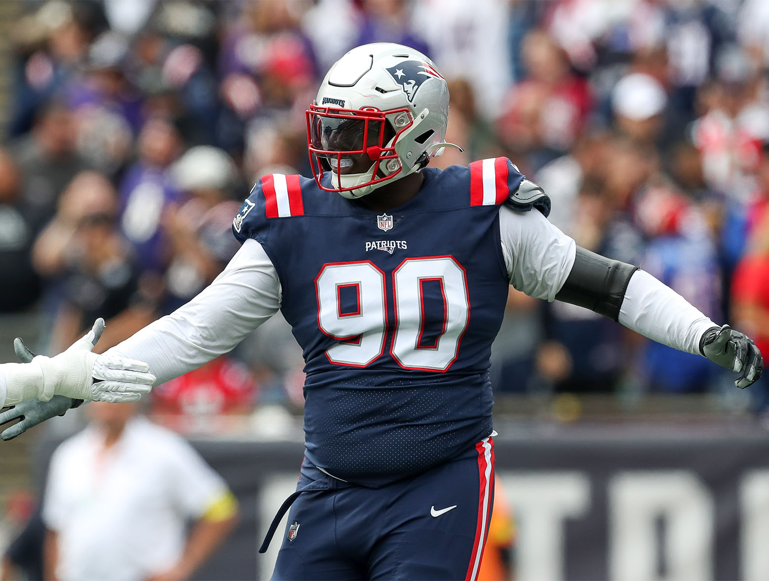 Sep 25, 2022; Foxborough, Massachusetts, USA; New England Patriots defensive tackle Christian Barmore (90) reacts during the first half against the Baltimore Ravens at Gillette Stadium. Mandatory Credit: Paul Rutherford-USA TODAY Sports